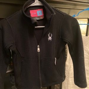 Spyder children's black jacket with fleece lining and two zippered pockets